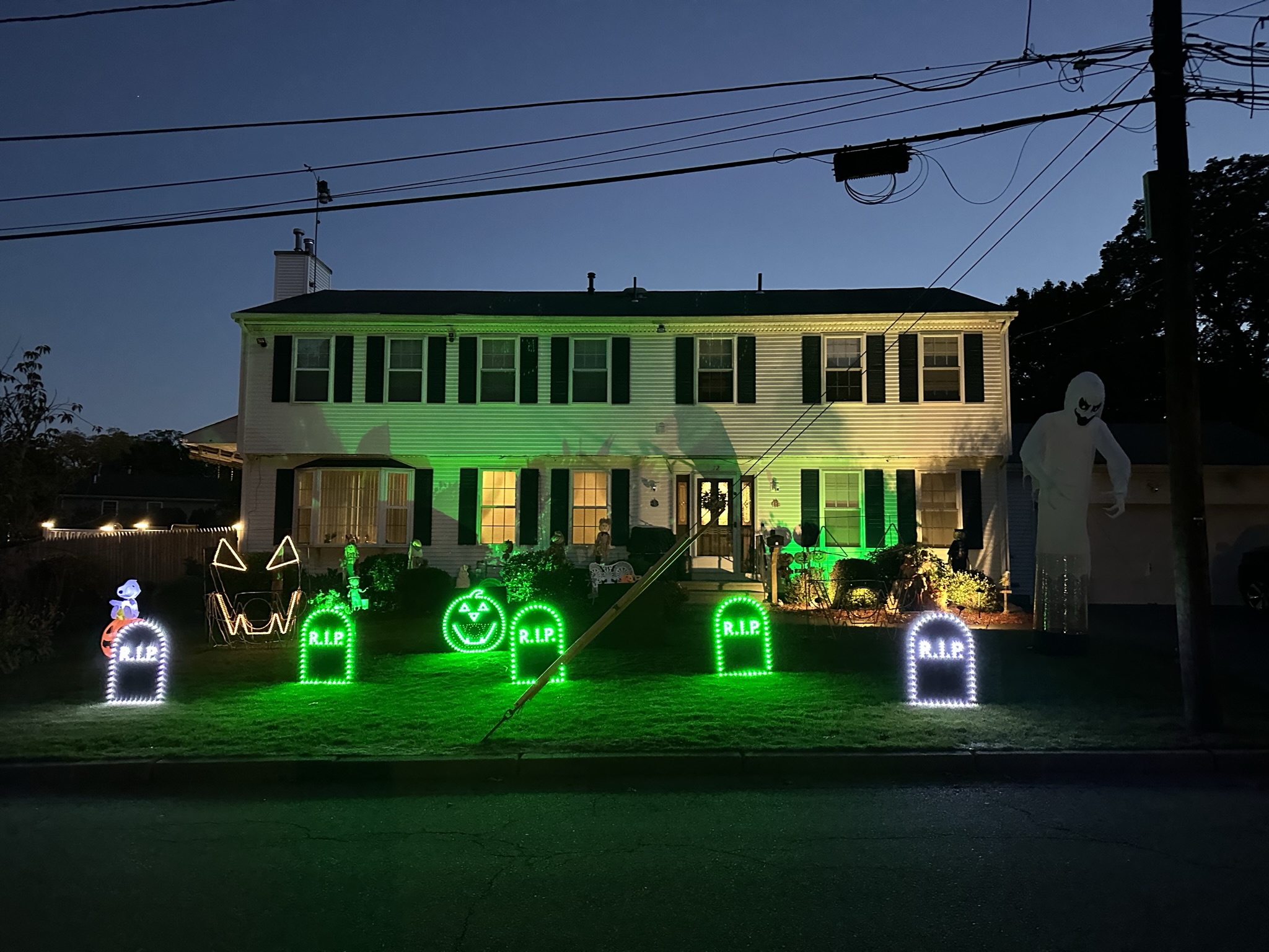 Lewis Halloween display glowing in the dark in Warwick Rhode Island